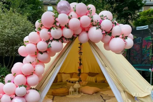 bell-tent-garden-glamping-hire-essex-pink-balloon-arch